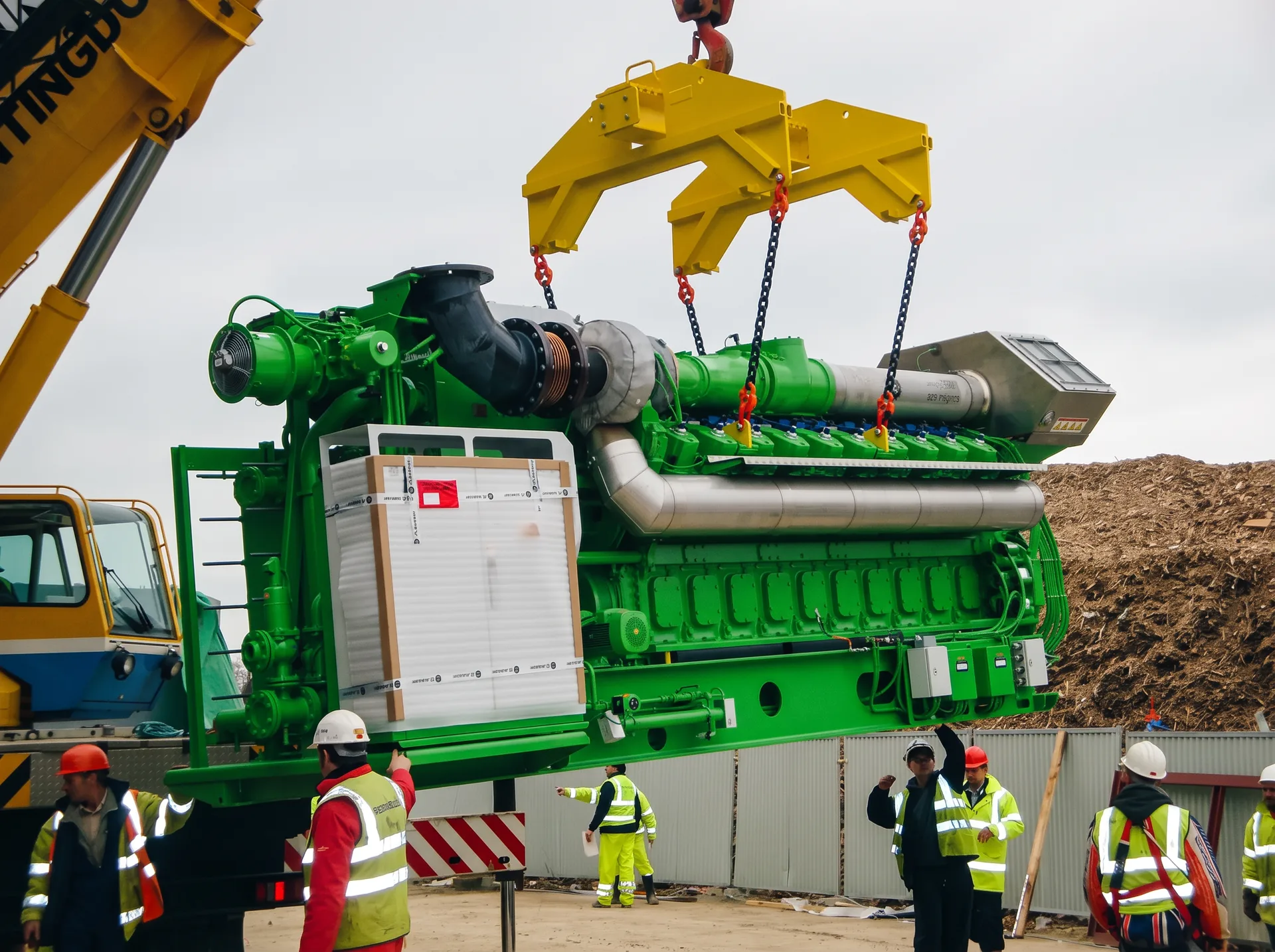 Large industrial generator engine being installed by an engineering team